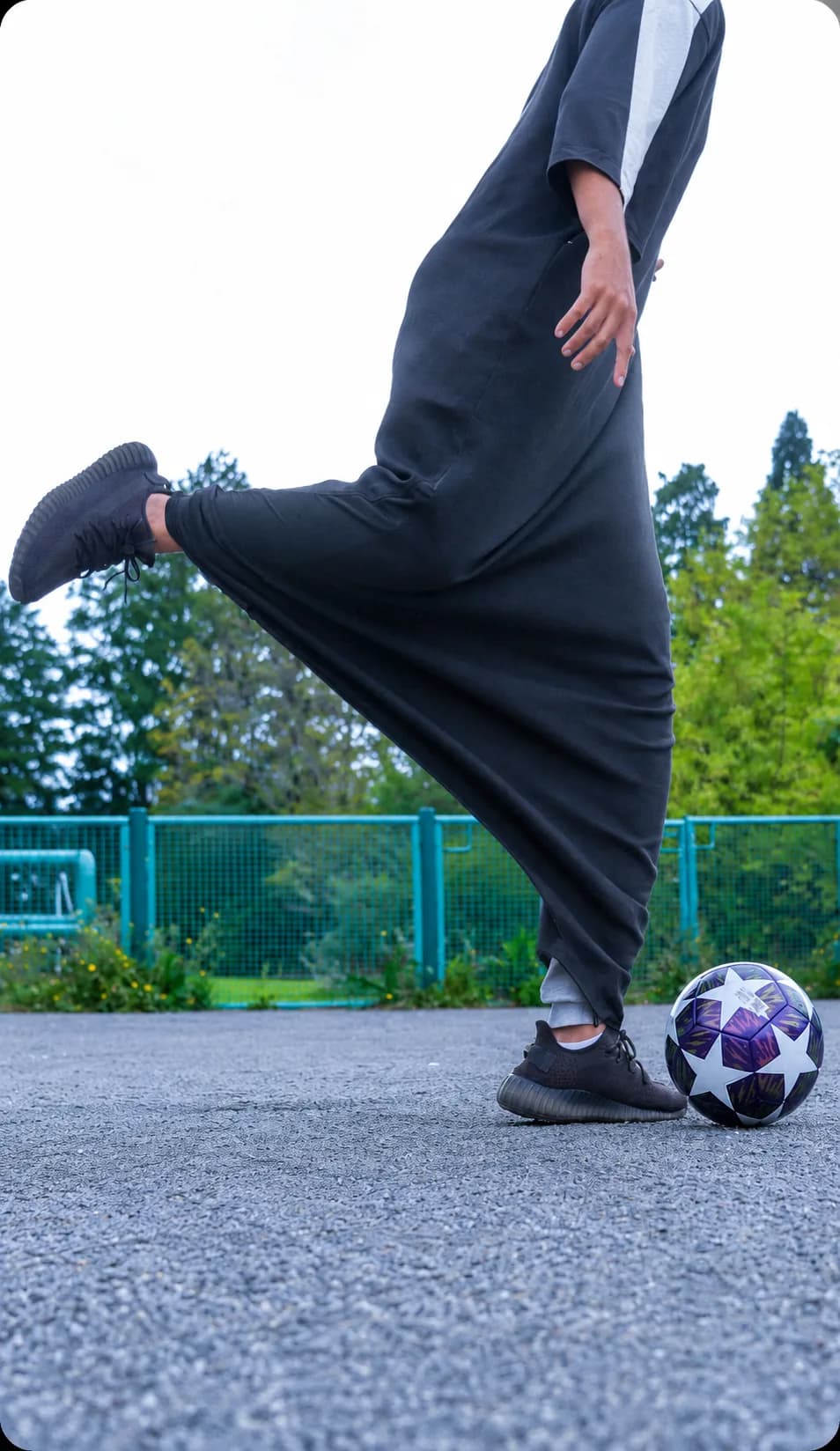 001_the_athlete kicking a football