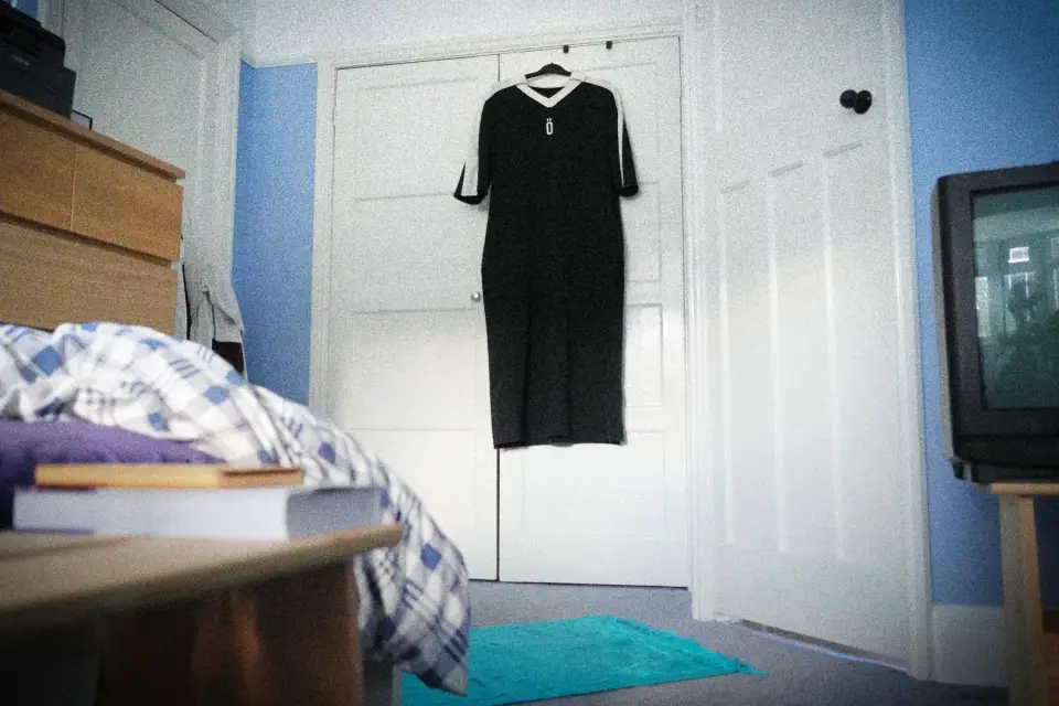 001_the_athlete hanging in a bedroom