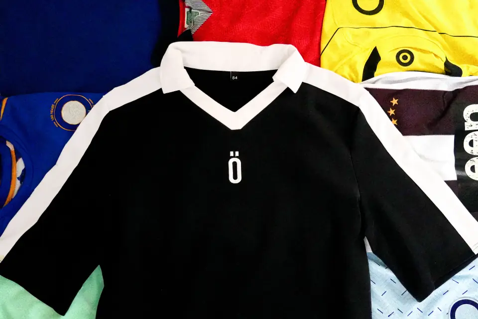 001_the_athlete displayed with vintage European football tops